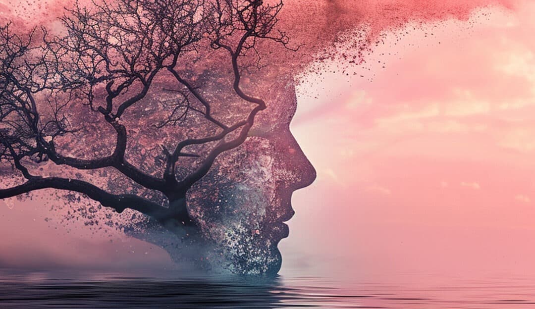 Image of a face dissolving into a tree with pink clouds, representing the transformative journey of addiction recovery at a rehab centre in Edenvale.